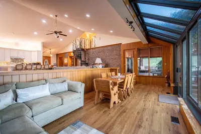 a living room with a couch and a table at Waterfront - Kawartha Lakes in Kawartha Lakes