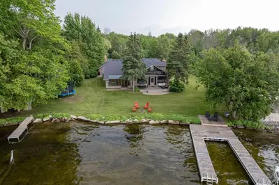 an aerial view of a house with a pond at Waterfront - Kawartha Lakes in Kawartha Lakes