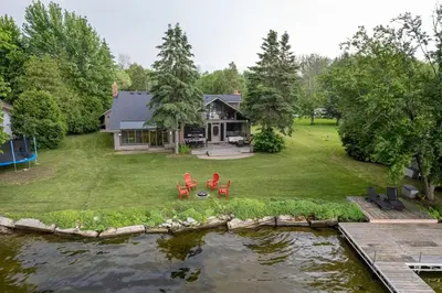 an aerial view of a house with a pond at Waterfront - Kawartha Lakes in Kawartha Lakes
