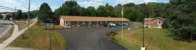 an overhead view of a building with a parking lot at Wellington Inn in Bracebridge