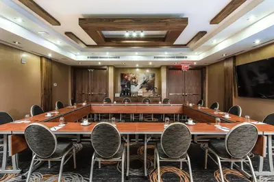 a large conference room with a large table and chairs at Delta Hotels by Marriott Waterloo in Waterloo