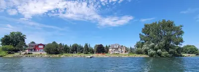 a view of a lake with houses and trees at SkyTime Vacations in Wellington