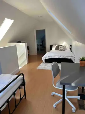 a bedroom with a bed and a table and chairs at Cottage Retreat on 11 Acres in Flesherton