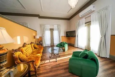 a living room with a couch and a table at Niagara Grandview Boutique Hotel in Niagara Falls