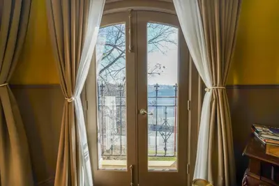 a room with two large windows with curtains at Niagara Grandview Boutique Hotel in Niagara Falls
