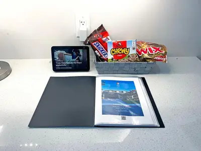 a book sitting on a counter with snacks and chips at Luxe Home Near Limeridge - Sleeps 11 - Pool in Hamilton