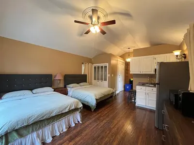a bedroom with two beds and a ceiling fan at THE RED STAR room E in Niagara Falls