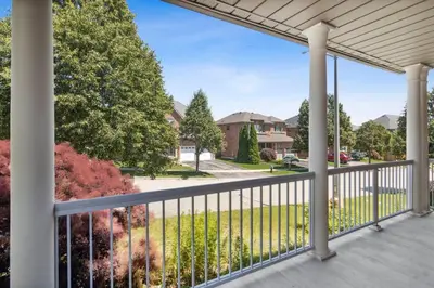 a balcony with a view of a yard at The cozy corner House in the Richmond Hill in Richmond Hill
