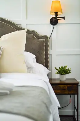 a bedroom with a bed with a table with a lamp at The Splendid - Luxury 1BR Uptown Toronto in Toronto