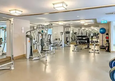 a gym with a lot of treadmills and machines at The Splendid - Luxury 1BR Uptown Toronto in Toronto