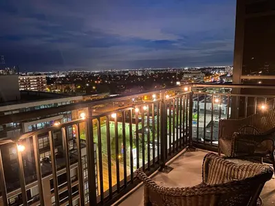 a view of a city at night from a balcony at The Splendid - Luxury 1BR Uptown Toronto in Toronto