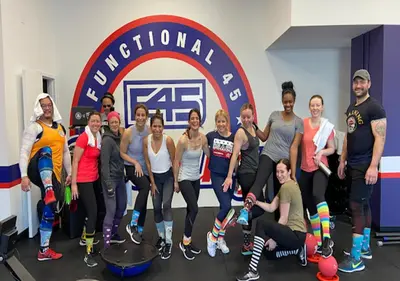 a group of people posing for a picture in a gym at The Splendid - Luxury 1BR Uptown Toronto in Toronto