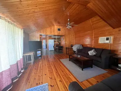 a living room with a couch and a table at Cottage in Crystal Beach in Fort Erie