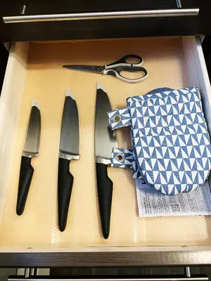 a box with three pairs of scissors and a bag at Stylish Boutique Studio in London
