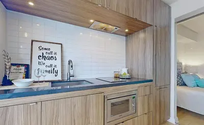 a kitchen with a sink and a counter top at University of Toronto UTSG Suites in Toronto