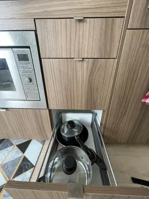 a kitchen with a stove and a microwave at University of Toronto UTSG Suites in Toronto