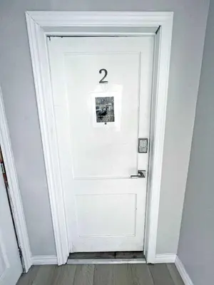 a white door with a number two on it at Hamilton Haven - Smart Tech and BBQ Oasis - Pool in Hamilton