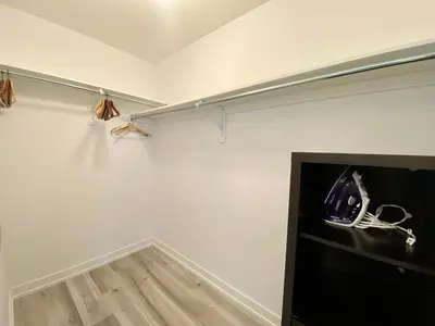 a room with a white wall with a phone on a shelf at 3 Bedroom Well-designed Townhouse in Whitby in Whitby