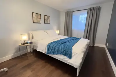 a bedroom with a bed and a window at Stylish Home in Prime Location North of Toronto in Richmond Hill