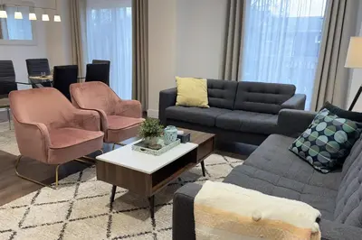 a living room with couches and chairs and a table at Stylish Home in Prime Location North of Toronto in Richmond Hill