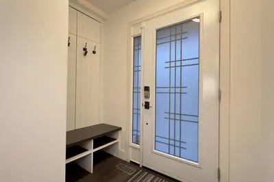 a hallway with a door and a window at Stylish Home in Prime Location North of Toronto in Richmond Hill