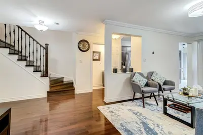 a living room with two chairs and a table at Luxury Home In Castlemore Brampton in Brampton