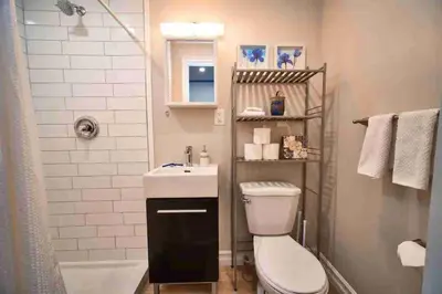 a bathroom with a toilet and a sink and a shower at Hamilton Oasis - Luxe Beds - BBQ Haven - Pool in Hamilton