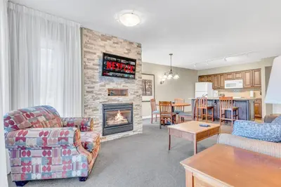 a living room with a couch and a fireplace at Spacious Hideaway in Nature in Edgar