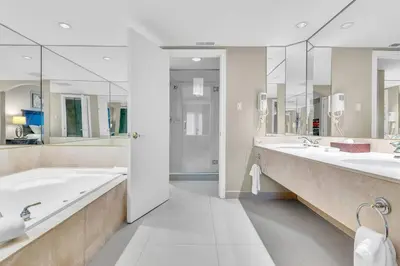 a large bathroom with two sinks and two mirrors at Spacious Hideaway in Nature in Edgar