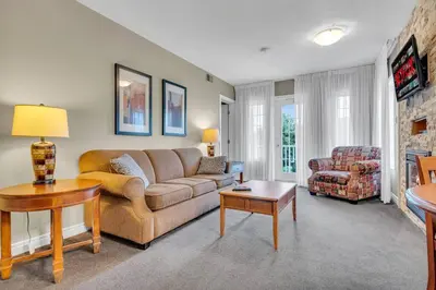a living room with a couch and a chair at Spacious Hideaway in Nature in Edgar