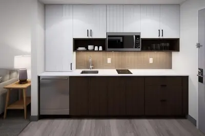 a kitchen with a sink and a microwave at Staybridge Suites Port Elgin by IHG in Port Elgin
