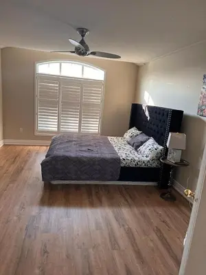 a bedroom with a bed and a window at Beautiful home in Mississauga