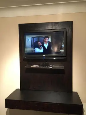 a flat screen tv in a wall at Mayflower Motel in Kitchener