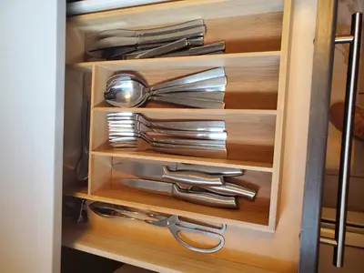 a drawer with silver utensils in a kitchen at *NEW: Stylish Wortley 1BR Suite in London