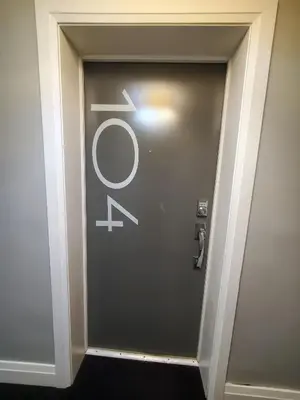 a elevator door with a sign on it at *NEW: Stylish Wortley 1BR Suite in London