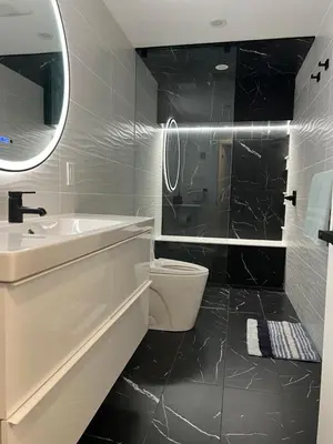 a bathroom with a sink toilet and a mirror at The Croft House - 2 Bedroom 1 Bathroom Suite in Burlington