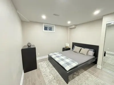 a bedroom with a bed and a window at Cozy 1.5 Guest-Suite in Aurora