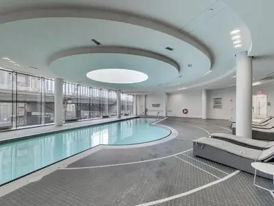 a large swimming pool in a large building at Beautiful Luxurious Modern Condo With Breathtaking Views in Toronto