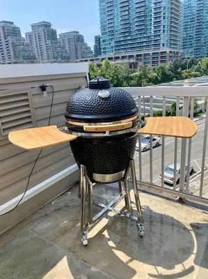 a grill sitting on top of a balcony at King West Private Rooftop Retreat in Toronto