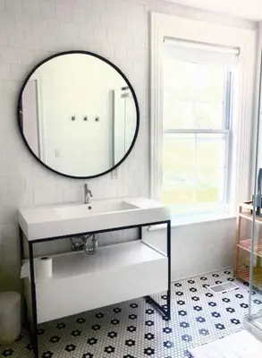 a bathroom with a sink and a mirror at The Gem - Beautiful farmhouse with hot tub in West Lake