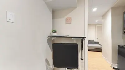 a room with a desk and a room with a bed at Finished 2 BR Apartment in an Upscale Area of Ajax in Ajax