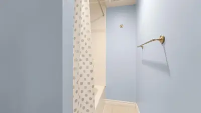 a shower in a bathroom with a shower curtain at Finished 2 BR Apartment in an Upscale Area of Ajax in Ajax