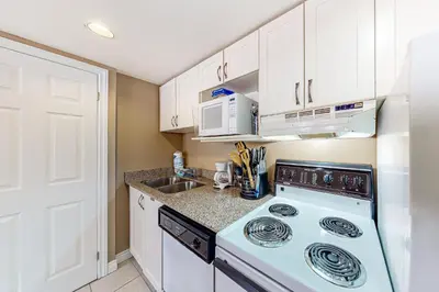 a kitchen with a stove and a sink at Condo 708 at North Creek Resort in Blue Mountains