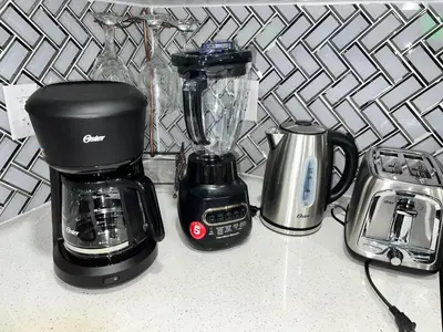 a kitchen counter with a blender and a toaster at Tosam Luxury Lodge Two Bedroom Suite in Brampton