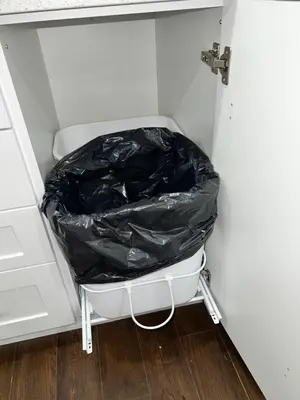 a bathroom with a toilet covered in a black garbage bag at Tosam Luxury Lodge Two Bedroom Suite in Brampton