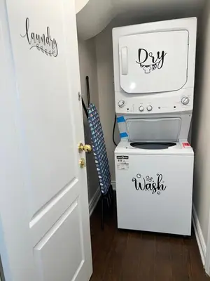 a kitchen with a microwave and a dishwasher at Tosam Luxury Lodge Two Bedroom Suite in Brampton