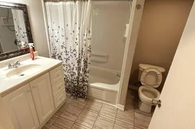 a bathroom with a sink and a toilet and a shower at Affordable stay near the OPG TV and parking in Pickering