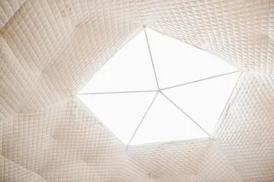 a kite hanging from the ceiling of a building at Open Sky Glamping Kawartha Dome in Marmora