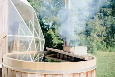 a grill with smoke coming out of it at Open Sky Glamping Kawartha Dome in Marmora