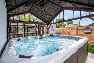 a large jacuzzi tub in a building at N7 Castle Green Retreat-Hot Tub in Toronto